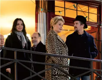  ??  ?? Juliette Binoche, Catherine Deneuve, Ethan Hawke and Clémentine Grenier in a scene from “The Truth.”