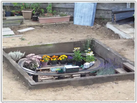  ??  ?? The line currently occupies the operating pit for something larger. I’m just not sure what yet, but the garden needs some attention first. Note the accurately modelled 12” scale sleepers. Ex-Felixstowe branch, I believe.