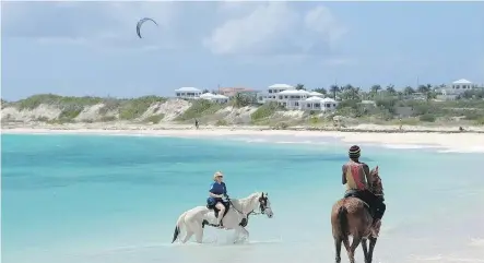  ?? PHOTOS: JIM BYERS ?? Take a horseback ride in the sea at one of the many beautiful beaches on Anguilla.