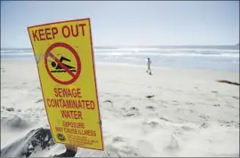  ?? Gregory Bull Associated Press ?? A BEACH in Coronado is closed in 2017 due to unhealthy conditions. Local officials say the federal government is ignoring its duty to help control pollution.