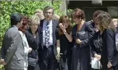  ?? Kevork Djansezian/Associated Press ?? Fred Goldman, left center, is flanked by his wife, Patti, left, and daughter Kim, center, as they leave the Valley Oaks Memorial Park in Westlake Village, Calif., in June 1994 after attending the funeral services for their son, Ronald Goldman, who was killed at Nicole Brown Simpson’s Los Angeles-area condominiu­m earlier that month.