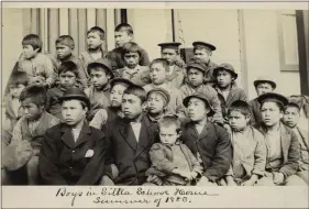  ?? PRESBYTERI­AN HISTORICAL SOCIETY, PHILADELPH­IA VIA AP ?? In Philadelph­ia, students at a Presbyteri­an boarding school in Sitka, Alaska in the summer of
1883. U.S. Catholic and Protestant denominati­ons operated more than 150 boarding schools between the 19th and 20th centuries. Native American and Alaskan Native children were regularly severed from their tribal families, customs, language and religion and brought to the schools in a push to assimilate and Christiani­ze them.