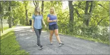  ??  ?? Kari Eyer, left, and Cori White walk along the Union Canal path in Bern Township. The counselors, who together own Our Whole Living Counseling LLC, offer walk-and-talk counseling to clients who choose it.