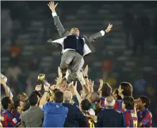  ?? Reuters ?? Barcelona players celebrate with Pep Guardiola after their 2009 Club World Cup final win over Estudiante­s in Abu Dhabi