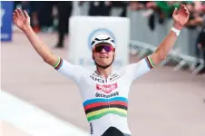  ?? — AFP photo ?? Van Der Poel celebrates as he cycles past the finish line to win the 121st edition of the Paris-Roubaix one-day classic cycling race, 260km between Compiegne and Roubaix, northern France.