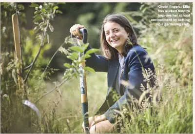  ??  ?? Green fingers: Ellie has worked hard to improve her school environmen­t by setting up a gardening club.