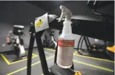  ??  ?? Disinfecta­nt spray has been attached to a machine at Sonoma Fitness in Petaluma.