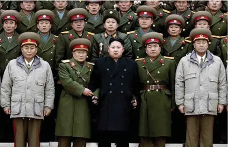  ?? KCNA/AFP/GETTY IMAGES FILE PHOTO ?? North Korean leader Kim Jong Un with soldiers of the Korean People’s Army on Jan. 1, 2012, not long after he took power following his father’s death.