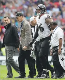  ?? MATTHEW LEWIS/GETTY IMAGES ?? Canadian defensive end Brent Urban of the Baltimore Ravens is helped off the field on Sunday in London, England after suffering a foot injury during a loss to the Jacksonvil­le Jaguars.