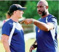  ?? IAN ALLEN ?? Montego Bay United’s head coach Luciano Gama (left) in discussion with Warren Barrett, former Reggae Boyz captain and goalkeepin­g coach at Montego Bay United.