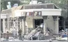  ?? ALEXANDER YERCOCHENK­O — THE ASSOCIATED PRESS ?? A security officer stands by a destroyed cafe after a blast killed rebel leader Alexander Zakharchen­ko, in Donetsk, Ukraine.