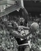  ?? Associated Press ?? Villanova’s Harold Pressley (21) goes up for a basket against Georgetown’s Patrick Ewing during the 1985 NCAA title game.