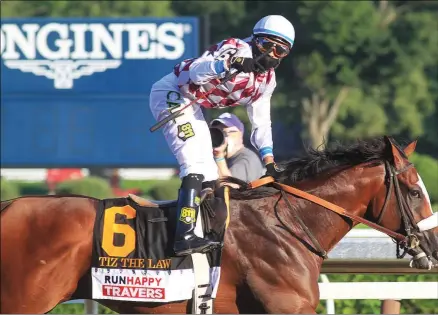  ?? PHOTO BY SPENCER TULIS, SPECIAL TO THE PINK SHEET ?? Tiz the Law and jockey Manny Franco won the Travers Stakes on August 8, 2020.