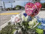  ?? LANNIS WATERS / THE PALM BEACH POST ?? A memorial sits Friday morning near the railway crossing on Ocean Avenue in Boynton Beach, where Jeffrey King was struck and killed by a Brightline train Wednesday.