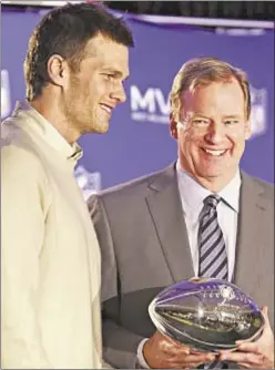  ?? THE ARIZONA REPUBLIC/AP ?? Tom Brady poses with Roger Goodell and Super Bowl MVP trophy (no, that’s not a deflated ball) in February.