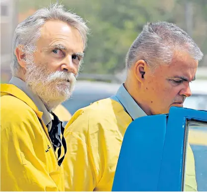  ?? ?? Jim Fitton, left, and Volker Waldmann, had to wear police handcuffs when they appeared in a Baghdad court