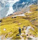  ?? Photo/ Supplied ?? Whanganui trampers descend from the Cascade Saddle with magic views of the Dart Glacier.