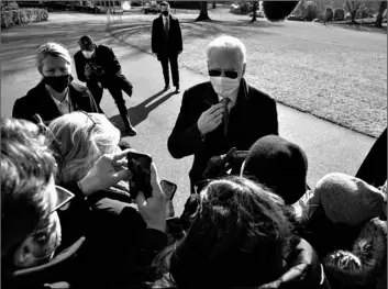  ?? AP Photo/Evan Vucci ?? President Joe Biden talks with reporters after arriving on the South Lawn of the White House, on Monday in Washington.
