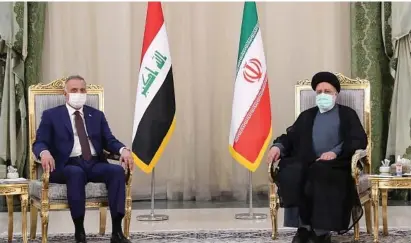  ?? (Presidenti­al website/handout via Reuters) ?? IRAN PRESIDENT Ebrahim Raisi meets Iraqi Prime Minister Mustafa al-Kadhimi in Tehran yesterday.