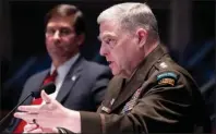  ?? The Associated Press ?? TESTIMONY: Defense Secretary Mark Esper, left, listens as Chairman of the Joint Chiefs of Staff Gen. Mark Milley testifies during a House Armed Services Committee hearing Thursday in Washington.