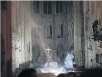  ?? PHOTO: AP ?? Smoulderin­g . . . Smoke rises in the interior of Notre Dame cathedral in the aftermath of yesterday’s fire.