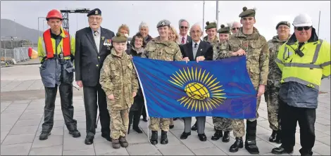  ?? 01_A11flag02 ?? The Army cadets, members of British Legion and port staff with the Commonweal­th flag ahead of the ceremony.