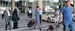  ?? | AFP ?? YEMENI passengers leave the Queen Alia Airport following their arrival to the Jordanian capital Amman yesterday, on the first commercial flight in nearly six years from Yemen`s rebel-held capital, Sana’a.