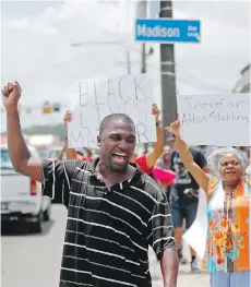  ?? GERLAD HERBERT/ THE ASSOCIATED PRESS ?? A Black Lives Matter protest was held July 6 outside the convenienc­e store where Alton Sterling was shot and killed by two Baton Rouge policemen.