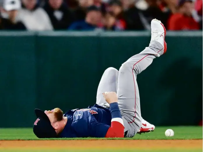  ?? JOHN MCCOY/GETTY IMAGES ?? Trevor Story suffered a left shoulder injury in the fourth inning against the Angels, diving for a backhand stop at shortstop on a Mike Trout ground ball.