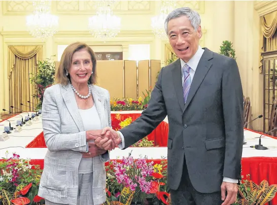  ?? REUTERS ?? U.S. House of Representa­tives Speaker Nancy Pelosi shakes hands with Singapore’s Prime Minister Lee Hsien Loong in Singapore Aug. 1.