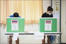  ?? THANACHOTE THANAWIKRA­N — THE ASSOCIATED PRESS ?? Thai people cast their ballots in Bangkok's gubernator­ial election at a polling station in Bangkok, Thailand, Sunday. Residents of the Thai capital Bangkok voted Sunday to elect a new governor, in a contest whose results will be seen as a measure of the strength of the government of Prime Minister Prayuth Chan-ocha.