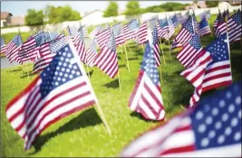  ?? FILE PHOTO ?? FLAGS ARE POSTED IN PREPARATIO­N FOR THE MEMORIAL DAY observance in Yuma. Veterans groups will again honor the sacrifices of men and women in uniform in various services and public events on Monday.