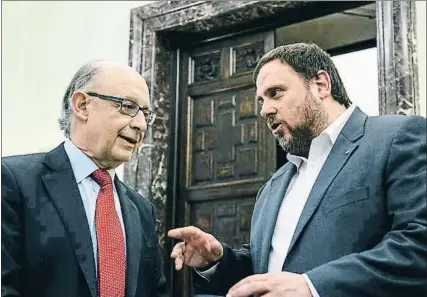  ?? DANI DUCH ?? El ministro Critóbal Montoro con el conseller Oriol Junqueras