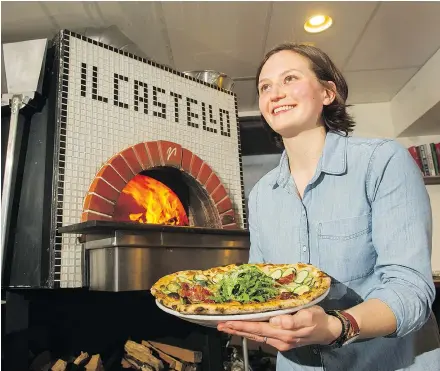  ?? PHOTOS: GERRY KAHRMANN/PNG ?? ‘Food was always an occasion in the family, always a big spread,’ says Francesca Galasso, owner of Il Castello. The pizzeria’s brick-lined, wood-fired pizza oven can be seen at left.