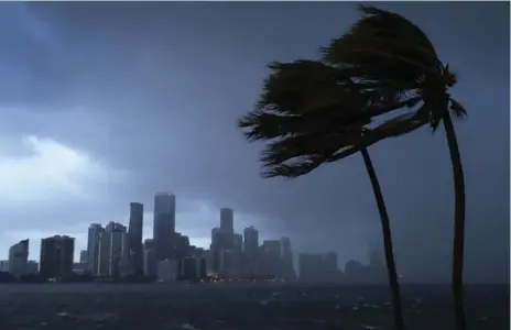  ?? JOE RAEDLE/GETTY IMAGES ?? Hurricane Irma took a westward swing toward the Gulf Coast that appeared to spare the Miami area of the direct hit forecaster­s had been warning of.