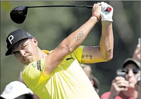  ?? AP/The Philadelph­ia Inquirer/JOSE F. MORENO ?? Rickie Fowler hits from the 10th tee during the first round of the BMW Championsh­ip at Aronimink Golf Club in Newtown Square, Pa. Fowler opened with a 5-under 65 and is in a tie for eighth with three others.