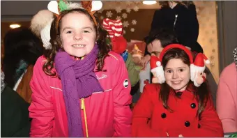  ??  ?? Abby McCarthy and Freya Power Beraufort at the Christmas in Killarney Santa Parade in Killarney on Saturday.Photo by Michele Cooper Galvin