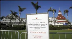  ?? PHOTO/GREGORY BULL,
AP ?? In this June 11 file photo a sign informing passersby of the hotel’s closure is posted outside the Hotel Del Coronado in Coronado, Calif. California’s unemployme­nt rate fell to 11.4% in August.