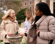  ?? TONY GUTIERREZ - THE ASSOCIATED PRESS ?? Alexis McCrossen, left, explains how a sun dial works to Hannah Spohn, center and Taylor Good, right, both freshman at Southern Methodist University in Dallas, Wednesday, Feb. 28. McCrossen, a history professor at SMU, has written books on marking time.