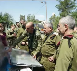  ?? (IDF Spokespers­on’s Unit) ?? IDF CHIEF OF STAFF Lt.-Gen. Gadi Eisenkot is briefed by senior officers at the scene of the terrorist attack in Halamish on July 22.