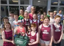  ?? Norma Doran presents a First Aid Kit to Lios Tuathail Athletics Club. ??