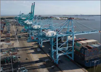  ?? (AP/Steve Helber) ?? A container ship is unloaded at the Port of Virginia in Norfolk.