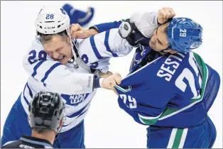  ?? CP FILE PHOTO ?? Former Toronto Maple Leafs enforcer battles with the Vancouver Canucks’ Tom Sestito in this file photo.