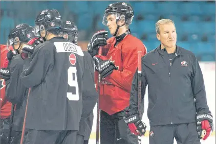  ?? CP PHOTO ?? Team Canada head coach Tim Hunter is seen during practice at the Sandman Centre in Kamloops, B.C., Monday, July, 30.
