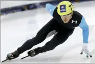  ?? RICK BOWMER — THE ASSOCIATED PRESS FILE ?? In this Jan. 5, 2014, file photo, Eduardo Alvarez competes in the men’s 1,000-meters during the U.S. Olympic short track speedskati­ng trials in Kearns, Utah. Alvarez became only the third American to earn medals at both the Summer and Winter Olympics when the United States beat defending-champion South Korea 7-2 Thursday night, Aug. 5, 2021, to gain a berth into this weekend’s gold medal game against host Japan.