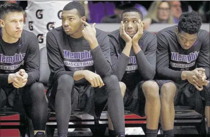  ?? PHOTOS BY MARK WEBER / THE COMMERCIAL APPEAL ?? Dejected Memphis teammates (from lef t) Caleb Wallingfor­d, K.J. Lawson, Jeremiah Martin and Dante Scot t watch from the bench late in the second half a s the Tigers lose to Houston 98-90 in Hofheinz Pavilion in Houston. The Tigers fell to 1-5 on the road this sea son and into seventh in the AAC.