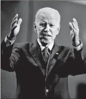  ?? SCOTT OLSON/GETTY ?? Joe Biden defended his civil rights record during an event last week at the Rainbow PUSH organizati­on in Chicago.