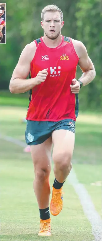 ?? Main picture: RICHARD GOSLING ?? Sam Day puts some miles in his legs at Gold Coast Suns training and (inset) being carried off in agony after his horrific hip injury last year.