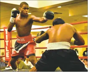  ?? PHOTO BY DANIEL CORK ?? North Point High School graduate Jordan White, 19, of Waldorf, earned a first-round knockout in his pro bantamweig­ht bout Aug. 19 at the Crystal City Hilton in Arlington, Va. versus Sergio Aguilar of Homestead, Fla., to improve to 3-0 in his career....