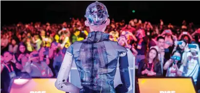  ?? — AFP ?? Sophia the Robot speaks to an audience in Hong Kong. AI is fundamenta­lly and steadily disrupting industries one by one.